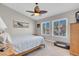Cozy bedroom with ceiling fan, natural light, and comfortable sleeping arrangements at 4647 Stearman Dr, North Las Vegas, NV 89031