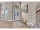 Bright entryway featuring wood floors, stylish decor, and ample natural light from large windows at 4647 Stearman Dr, North Las Vegas, NV 89031