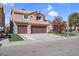 Charming two-story home with a three-car garage, tile roof, and well-maintained landscaping at 4647 Stearman Dr, North Las Vegas, NV 89031