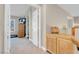 Upstairs hallway featuring access to rooms, natural light, and views of neighborhood at 4647 Stearman Dr, North Las Vegas, NV 89031