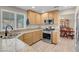 Kitchen with stainless steel appliances, granite countertops, sink, and cabinetry at 4647 Stearman Dr, North Las Vegas, NV 89031