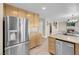 Kitchen featuring stainless steel appliances, granite counters and wood cabinets at 4647 Stearman Dr, North Las Vegas, NV 89031