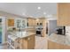 Bright kitchen boasts stainless steel appliances, granite counters and breakfast bar at 4647 Stearman Dr, North Las Vegas, NV 89031