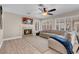 Living room featuring neutral decor, fireplace, sofa, ceiling fan and shuttered windows at 4647 Stearman Dr, North Las Vegas, NV 89031
