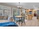 Open living space flows to kitchen, offering dining, fireplace and backyard access at 4647 Stearman Dr, North Las Vegas, NV 89031