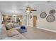 Comfortable living room with open floor plan and adjacent kitchen features modern decor at 4647 Stearman Dr, North Las Vegas, NV 89031
