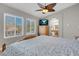 Bedroom featuring bright windows and an ensuite bathroom with a skylight for natural light at 4647 Stearman Dr, North Las Vegas, NV 89031