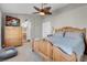 Comfortable main bedroom features an ensuite bathroom, fan and closet at 4647 Stearman Dr, North Las Vegas, NV 89031