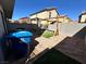 Backyard featuring a pergola with swing, synthetic grass, and easy to maintain gravel at 4924 Chidlaw Ave # 3, Las Vegas, NV 89115
