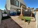 Cozy backyard offers outdoor living with pergola, grill, and easy-care gravel landscaping at 4924 Chidlaw Ave # 3, Las Vegas, NV 89115