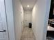 Bright hallway featuring neutral tile flooring and access to various rooms at 4924 Chidlaw Ave # 3, Las Vegas, NV 89115