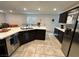 Kitchen features modern appliances, a breakfast bar and dark cabinets at 4924 Chidlaw Ave # 3, Las Vegas, NV 89115
