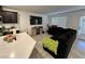 Bright, open concept living area features a black sofa and modern decor for relaxing at 4924 Chidlaw Ave # 3, Las Vegas, NV 89115