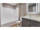 Bathroom with sleek vanity, updated lighting, and modern shower-tub combo at 5000 Red Rock St # 120, Las Vegas, NV 89118