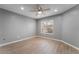 Bedroom features wood-look flooring, neutral wall color, and ceiling fan with recessed lighting at 5000 Red Rock St # 120, Las Vegas, NV 89118
