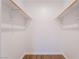 Bright closet featuring wood floors and two levels of wooden shelving at 5000 Red Rock St # 120, Las Vegas, NV 89118