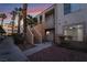 Modern building exterior showcasing private entrances, staircase and beautiful landscaping providing an immediate sense of home at 5000 Red Rock St # 120, Las Vegas, NV 89118