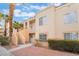 Exterior of a multi-story condo building with staircases and landscaping at 5000 Red Rock St # 120, Las Vegas, NV 89118