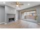 Living room featuring a fireplace, hardwood floors, and access to an outdoor patio at 5000 Red Rock St # 120, Las Vegas, NV 89118