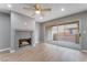 Living room showcasing a fireplace, wood floors, and sliding glass doors to a patio at 5000 Red Rock St # 120, Las Vegas, NV 89118