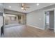 Living space boasts hardwood floors, sliding door to patio, and neutral color palette at 5000 Red Rock St # 120, Las Vegas, NV 89118