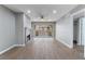 Open living room featuring fireplace, wood floors, sliding door to patio, and recessed lighting at 5000 Red Rock St # 120, Las Vegas, NV 89118