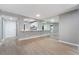 Open living area with view into the kitchen, featuring wood-style flooring at 5000 Red Rock St # 120, Las Vegas, NV 89118
