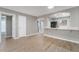 Open living area with wood-style floors looking toward kitchen featuring a serving bar at 5000 Red Rock St # 120, Las Vegas, NV 89118