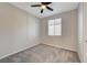 Bedroom showcasing neutral walls, carpet floors, one window, and ceiling fan at 5040 Serene Skies St, Las Vegas, NV 89130