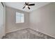 Bedroom showcasing neutral walls, carpet floors, one window, and ceiling fan at 5040 Serene Skies St, Las Vegas, NV 89130