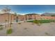 Exterior shot of community park featuring gravel, green turf, picnic tables, landscaping and walking paths at 5040 Serene Skies St, Las Vegas, NV 89130
