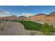 Exterior shot of community park featuring gravel, green turf, picnic tables, landscaping and walking paths at 5040 Serene Skies St, Las Vegas, NV 89130