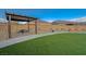 Exterior shot of community park featuring gravel, green turf, picnic tables, landscaping and walking paths at 5040 Serene Skies St, Las Vegas, NV 89130