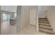 Open-concept foyer with hardwood floors, leading to living spaces and stairs at 5040 Serene Skies St, Las Vegas, NV 89130