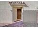 Inviting front door with brickwork and minimalist modern covered entrance at 5040 Serene Skies St, Las Vegas, NV 89130