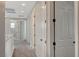 Upstairs hallway with carpet floors and white doors at 5040 Serene Skies St, Las Vegas, NV 89130
