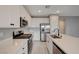 Contemporary kitchen with white cabinets, stainless steel appliances, and a center island at 5040 Serene Skies St, Las Vegas, NV 89130