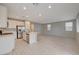 Open-concept kitchen featuring stainless steel appliances and a center island at 5040 Serene Skies St, Las Vegas, NV 89130
