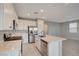 Well-lit kitchen with stainless steel appliances and a center island at 5040 Serene Skies St, Las Vegas, NV 89130