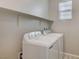 Bright laundry room featuring washer and dryer at 5040 Serene Skies St, Las Vegas, NV 89130