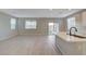 Spacious living room featuring tile flooring, a modern color palette, and plenty of natural light at 5040 Serene Skies St, Las Vegas, NV 89130