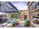 Outdoor backyard with a covered area featuring a barbecue grill and play area at 5706 W Lake Mead Blvd, Las Vegas, NV 89108