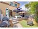 Outdoor patio and backyard with a barbecue, fire pit, and play area at 5706 W Lake Mead Blvd, Las Vegas, NV 89108
