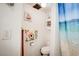 Clean bathroom showcasing a toilet and a beach-themed shower curtain at 5706 W Lake Mead Blvd, Las Vegas, NV 89108