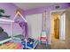 bedroom featuring colorful walls, a house frame bed, and playful decorations at 5706 W Lake Mead Blvd, Las Vegas, NV 89108