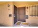 Exterior view of side-by-side front doors with security gates and updated fixtures at 5706 W Lake Mead Blvd, Las Vegas, NV 89108