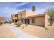 Inviting two-story building featuring a desert landscape with a palm tree in view at 5706 W Lake Mead Blvd, Las Vegas, NV 89108