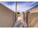 Narrow walkway between two buildings with a concrete path and partial shade at 5706 W Lake Mead Blvd, Las Vegas, NV 89108