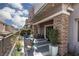Charming back patio with lounge seating, vibrant plants, and an inviting outdoor atmosphere at 600 N Carriage Hill Dr # 1081, Las Vegas, NV 89138