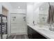 Modern bathroom featuring a glass-enclosed shower and double vanity sink at 600 N Carriage Hill Dr # 1081, Las Vegas, NV 89138